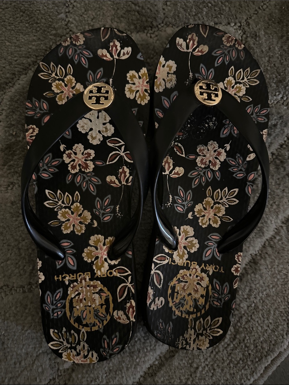 Tory Burch Black Floral Logo Flip Flop Sandals with Gold Medallions
